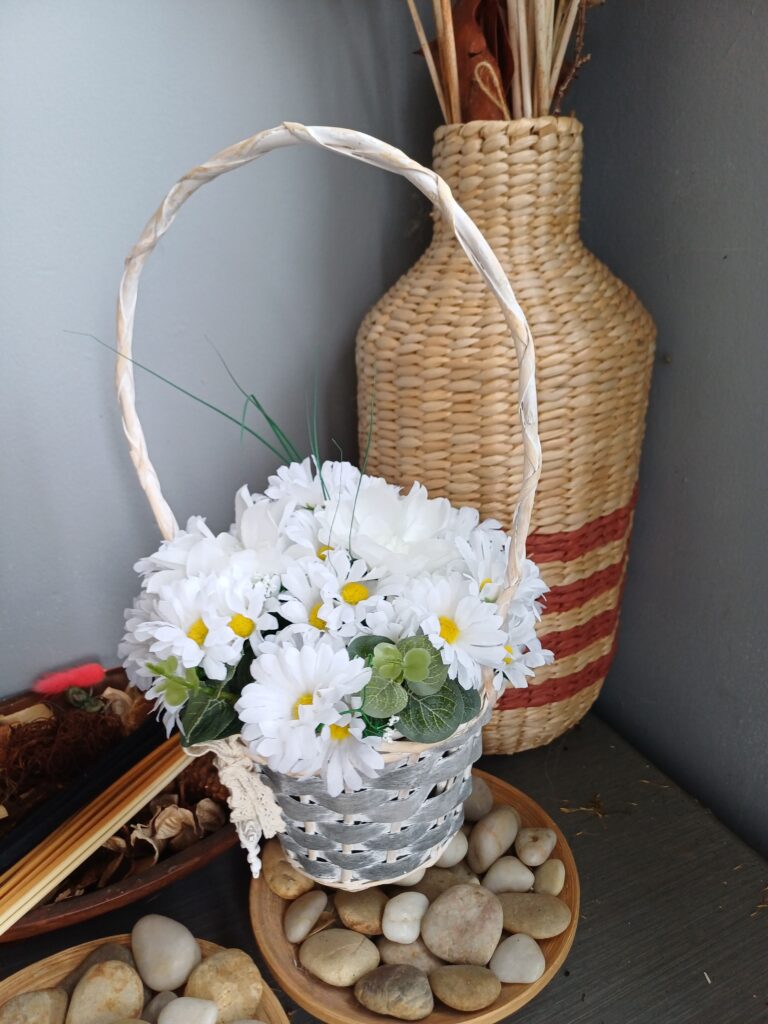 Image of a basket of white silk daisies