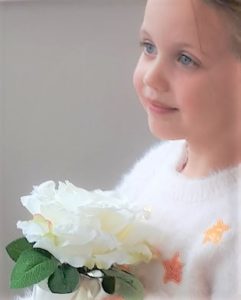 flower girl with large cream rose wand