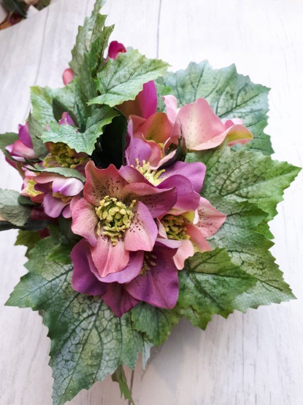 Picture of mauve and pink petals surrounded by greenery