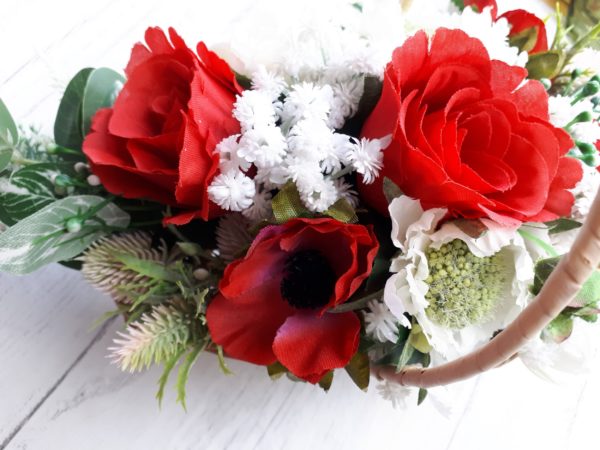 Close up imag of red silk roses, white silk scabious and white faux flowers