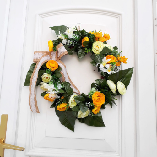 Image of spring flower door wreath in yellow and white silk flowers