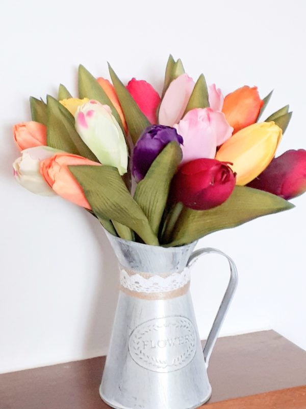 Image of multicoloured tulips in a small jug