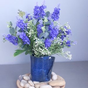Image of Blue ceramic vase and purple lavender spears
