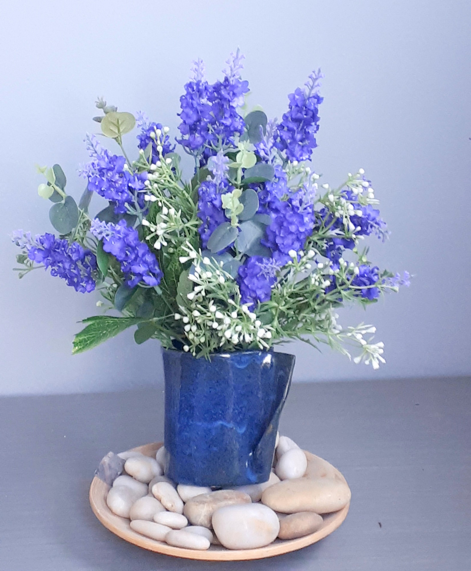 Image of Blue ceramic vase and purple lavender spears