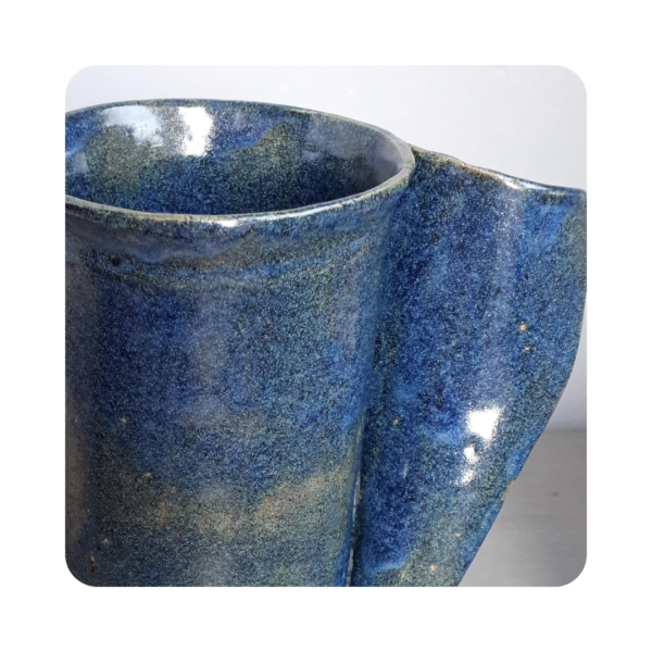 Closeup image of blue ceramic vase