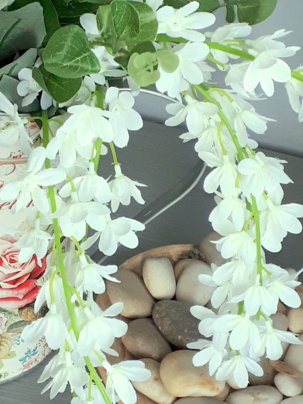 Close up of white silk wisteria flowers