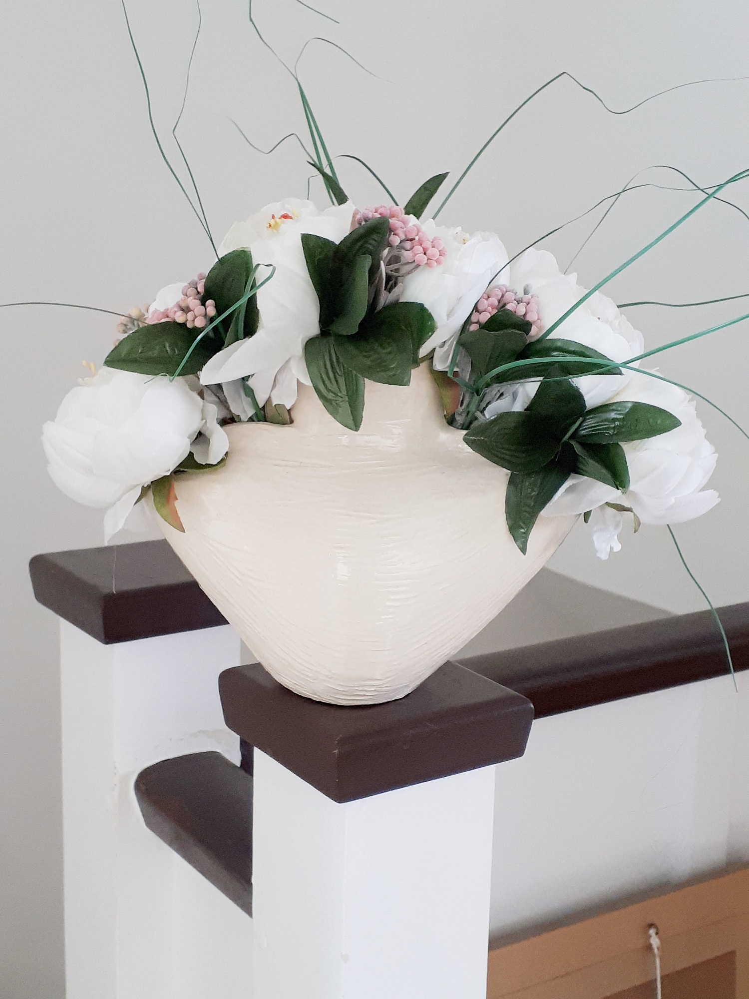 White ceramic vase with silk peonies