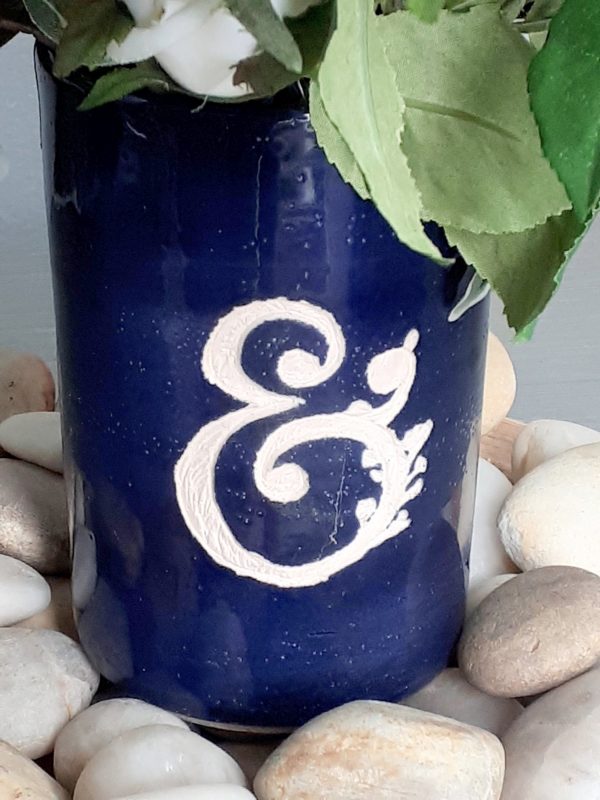 Blue ceramic vase with white amphisand