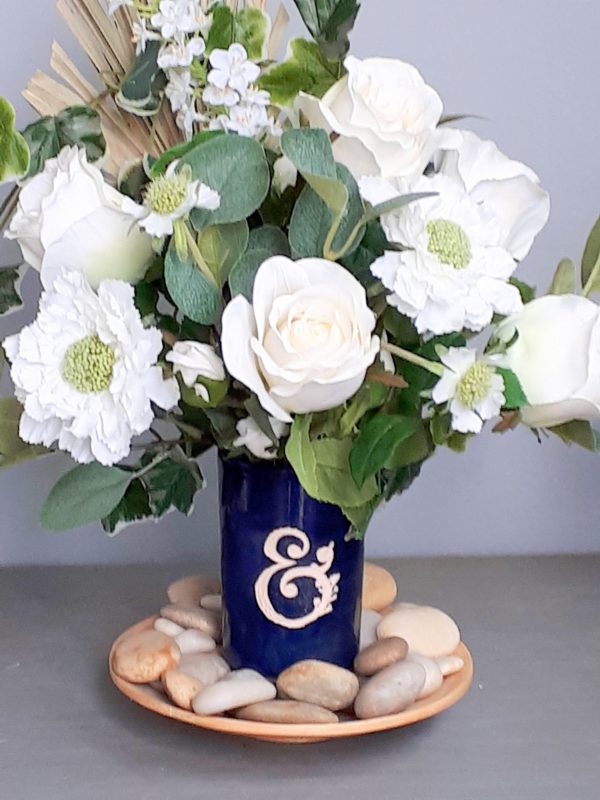 White flowers in a blue vase