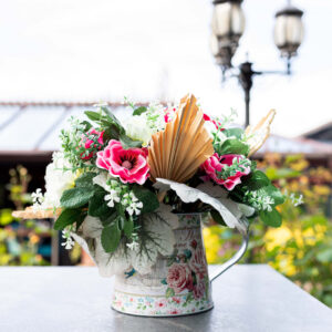 Windflower anemone table centre with pink and cream flowers on an outside table