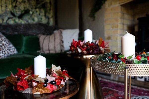 Rustic autumn tabl entre with faux berries, toadstools and hops