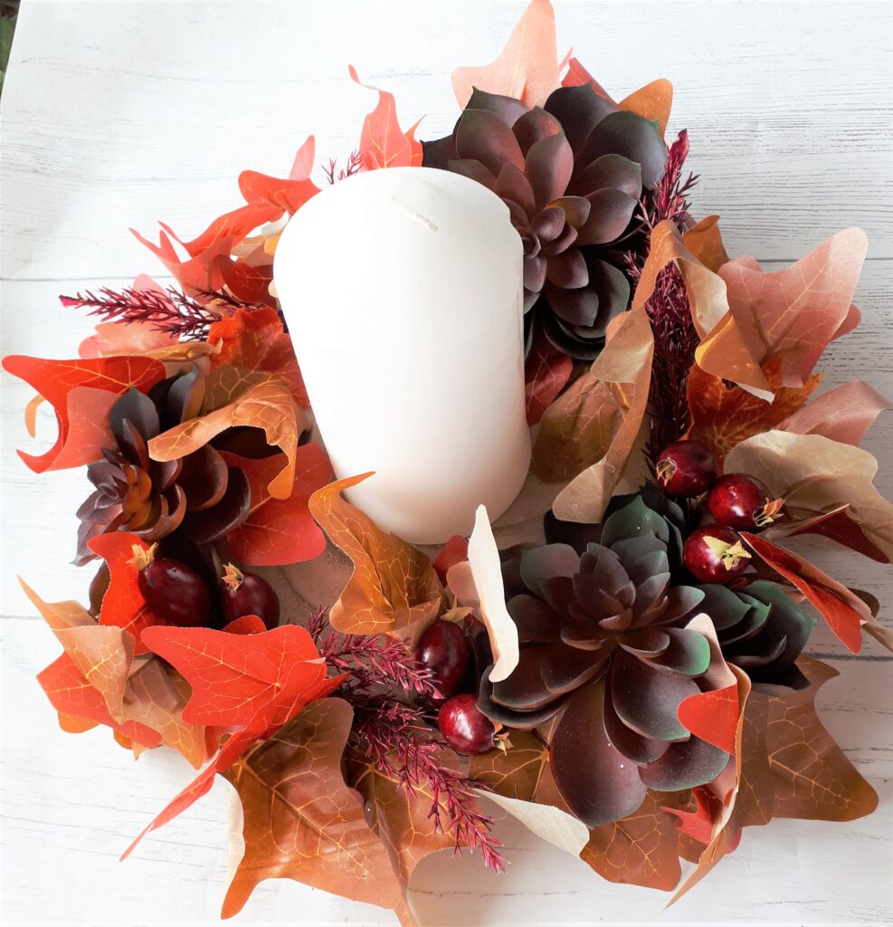 Image of autumn tablecentre with burgundy faux succulents