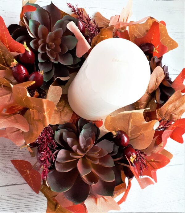 Image of autumn table centre with huge faux burgundy succulents