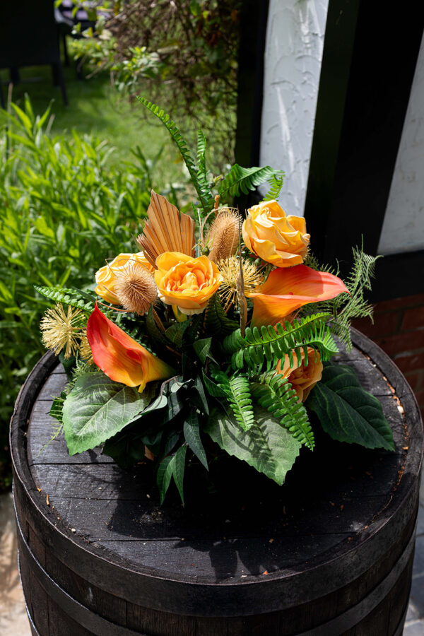 Sunshine Glow Tabble centre with orange calla lilies and orange roses