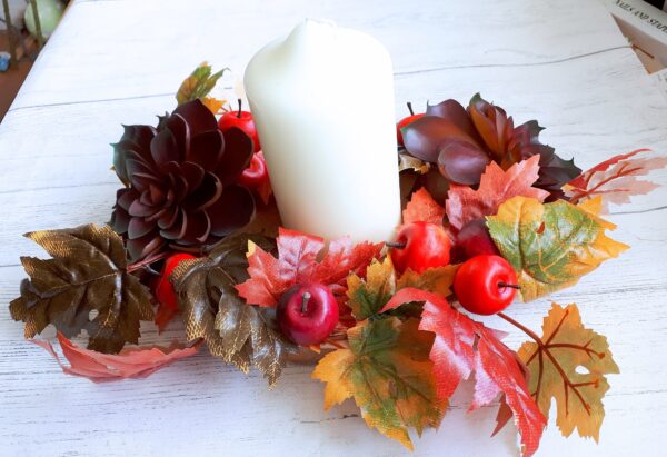 Image of autumn table centre with faux burgundy succulents