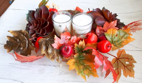 Image of autumn table centre with faux burgundy succulents