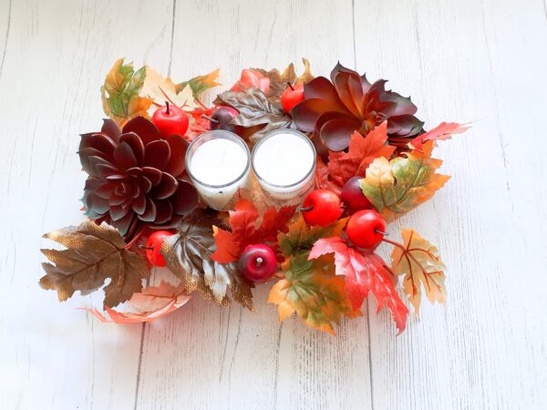 Image of autumn table centre with faux burgundy succulents