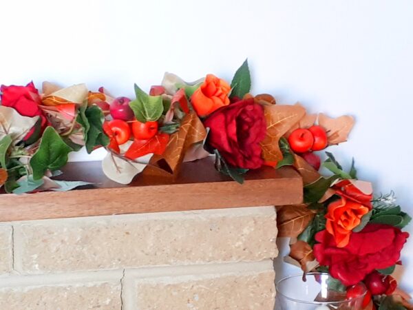 Autumn mantel garland of autumn ivy leaves, red silk rose and orange silk roses