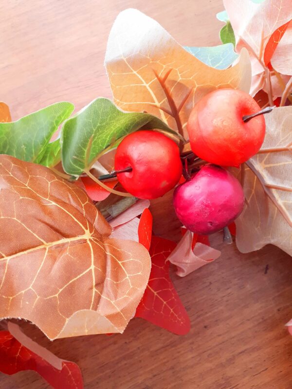 Autumn mantel garland of autumn ivy leaves, and red fruits