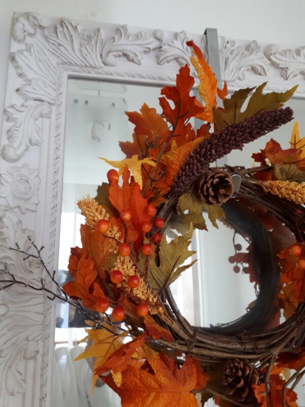 Autumn golds in an autumn wreath of faux ivy and oak leaves, with natural pinecones