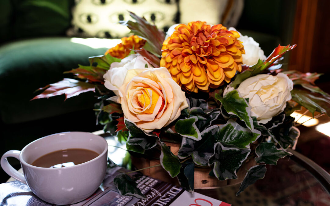 Autumn gold, ornage and bronze in a table arrangement of silk flowers