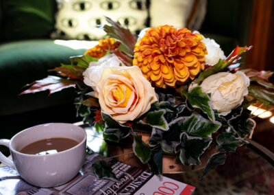 Autumn gold, ornage and bronze in a table arrangement of silk flowers