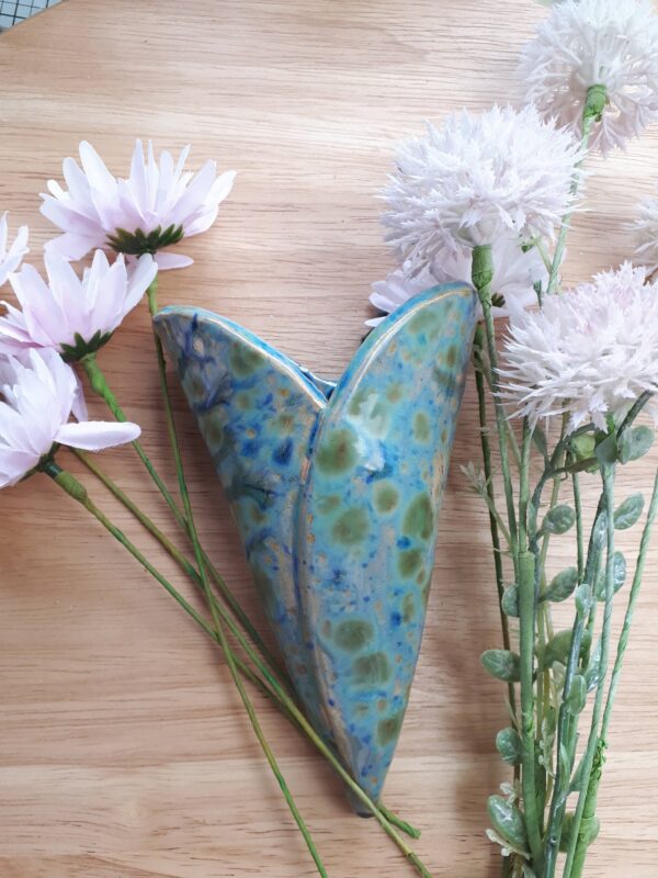 Heart shaped ceramic bud vase for hanging on the wall