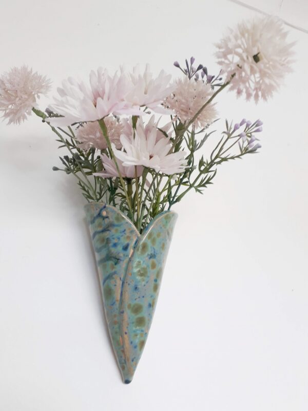 Image of heart shaped wall hanging bud vase with faux flowers