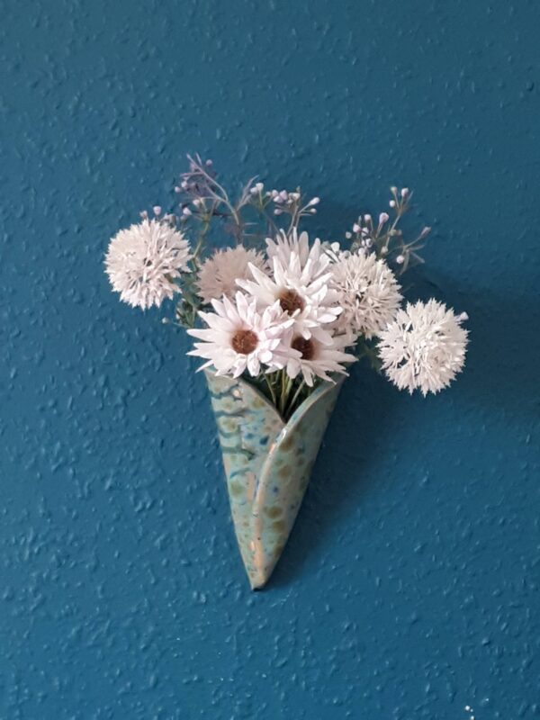 Image of heart shaped wall hanging bud vase with faux flowers