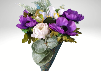 Wall hanging ceramic vase with purple silk flowers