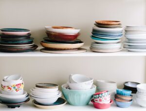 Mixed vintage plates on two shelves