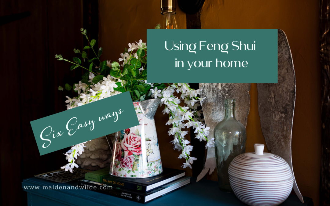 Image of floral jug with trailing white wisteria. Title Using Feng Shui in your home: Six Easy Ways