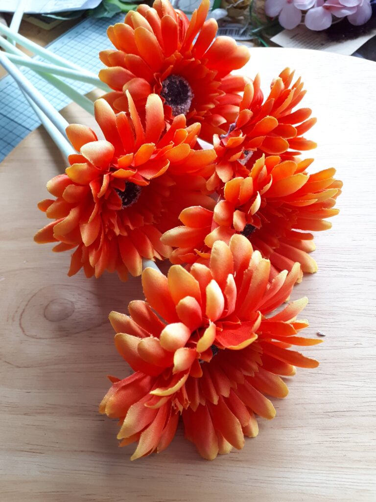 Image of deep orange gerbera flowers