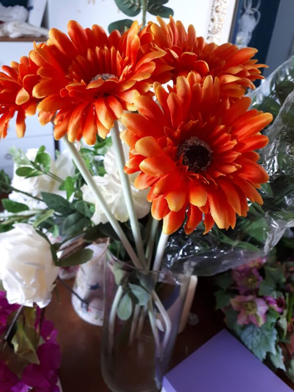 Image of deep orange gerbera flowers
