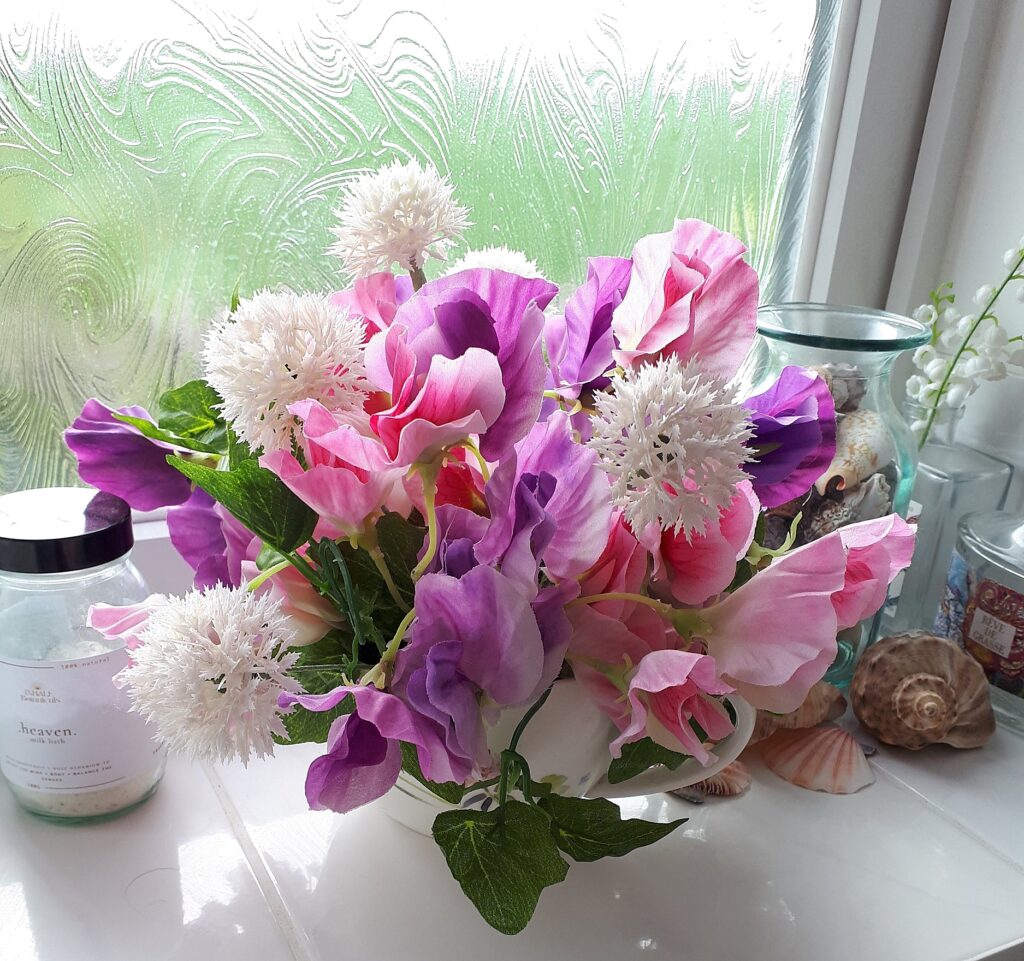 Image of pink and mauve sweet peas with pale pink faux alliums