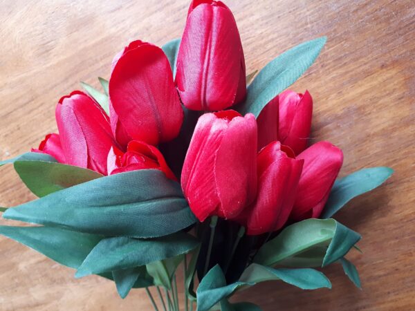 Bunch of vibrant red silk tulips