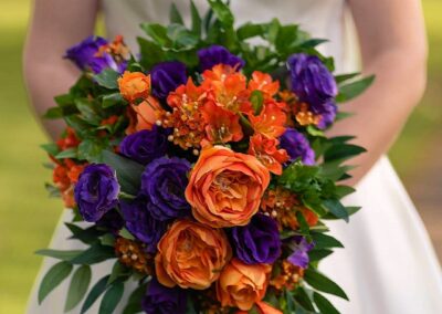 Real bride's orange and purple cascade bouquet