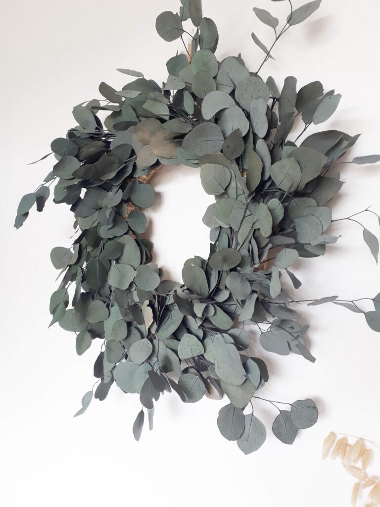 photo of blue grey preserved eucalyptus in a wreath