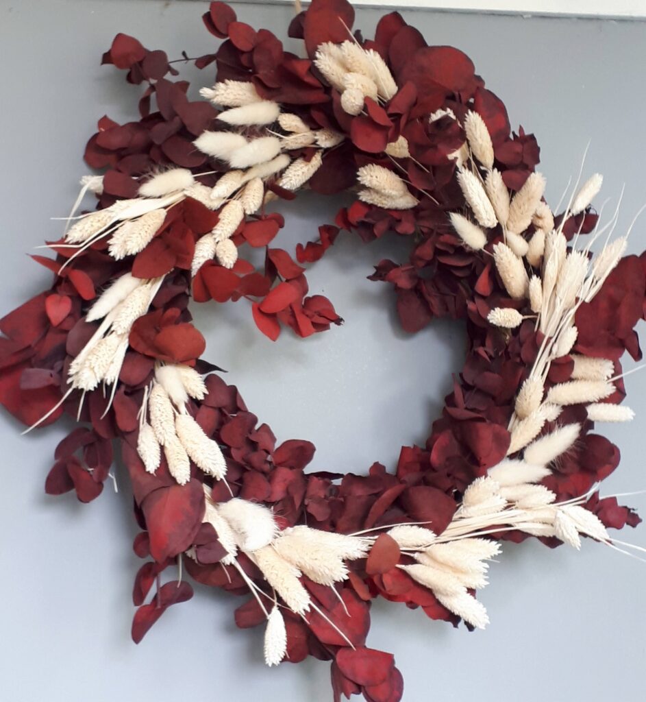 Red preserved eucalyptus wreath with dried white grasses