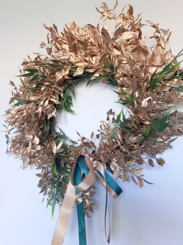 Image of a bright gold ruscus luxury festive wreath with green accents