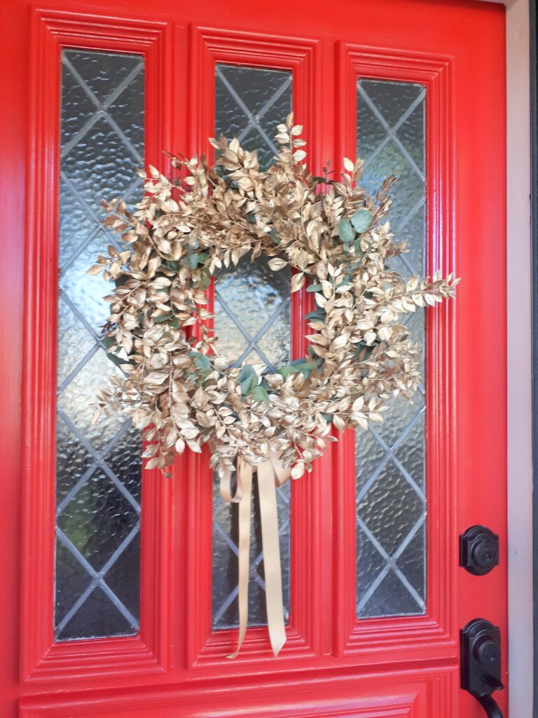 Gold leaf wreath on red door