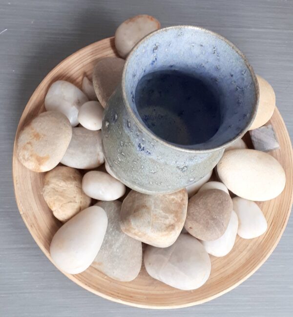 Bird's eye view of ceramic bud vase with blue grey glaze