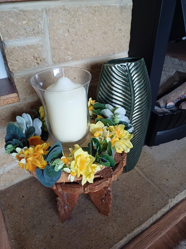 Image of spring flower table centre, with a magazine and cup of coffee.