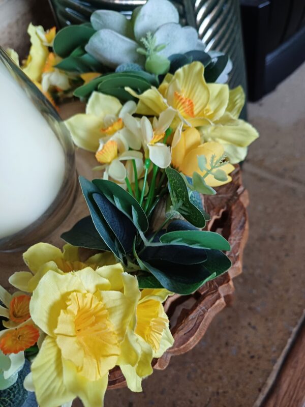 Image of spring flower table centre, showing yellow daffodils and jonquils