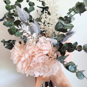 Image of bouquet with dried and preserved pink and grey flowers and foliage
