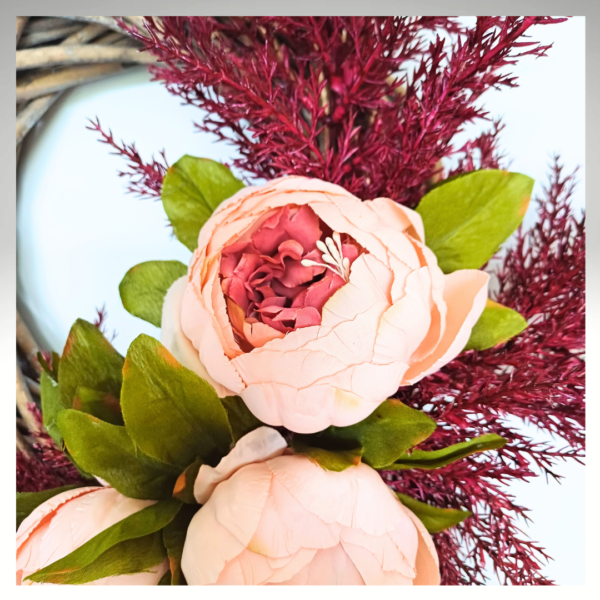 Closeup of peach and deep pink silk peony