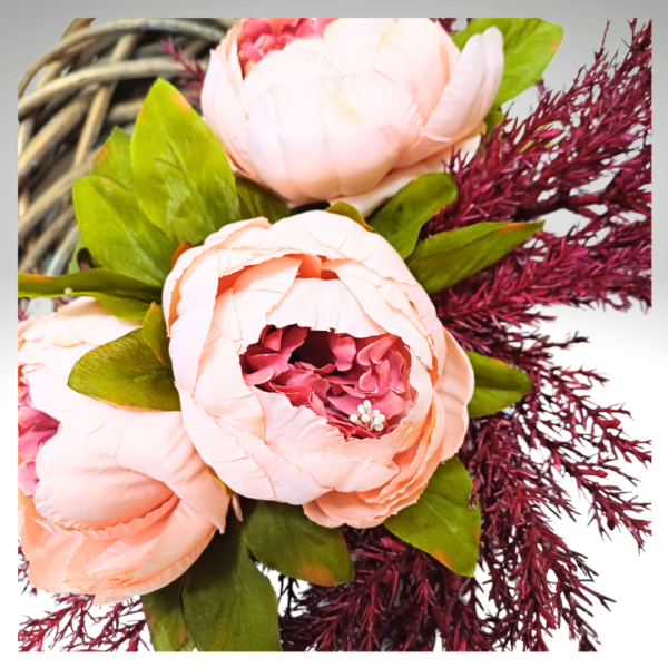 Closeup of peach and deep pink silk peony