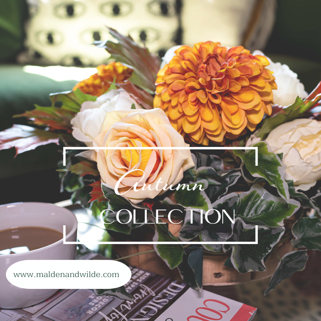 Autumn Collection Image of table arrangement with deep orange and peach flowers