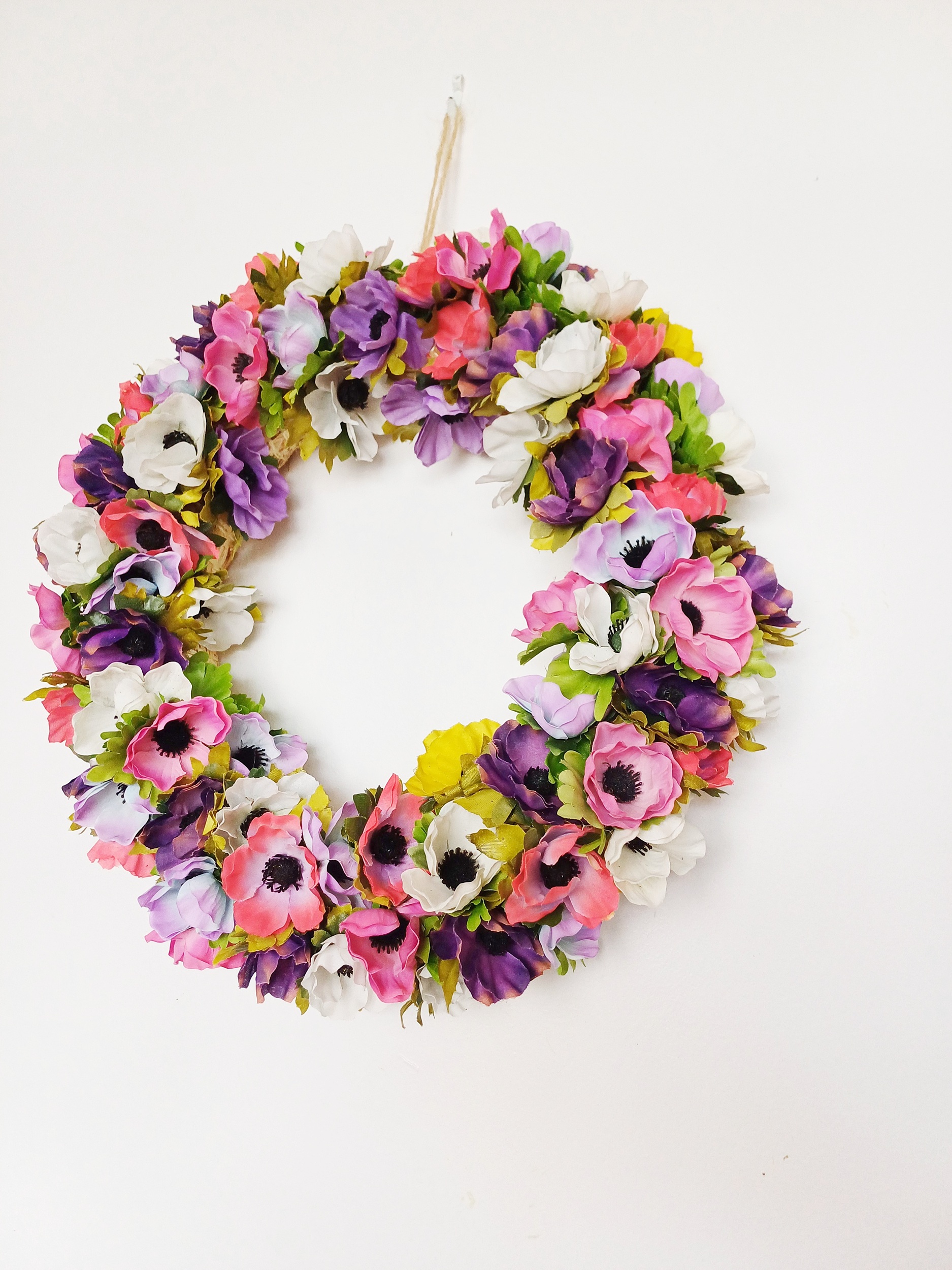 Spring Silk Flower Anemone Wreath Wreath of spring silk anemone flowers in multi colours - pinks, purples, yellow and white