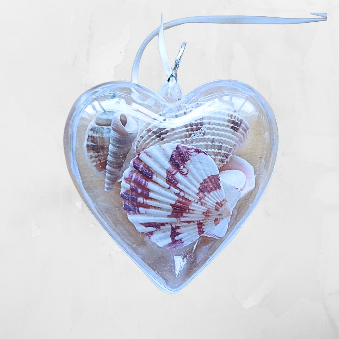 Heart shaped clear ornament with mixed pretty shells